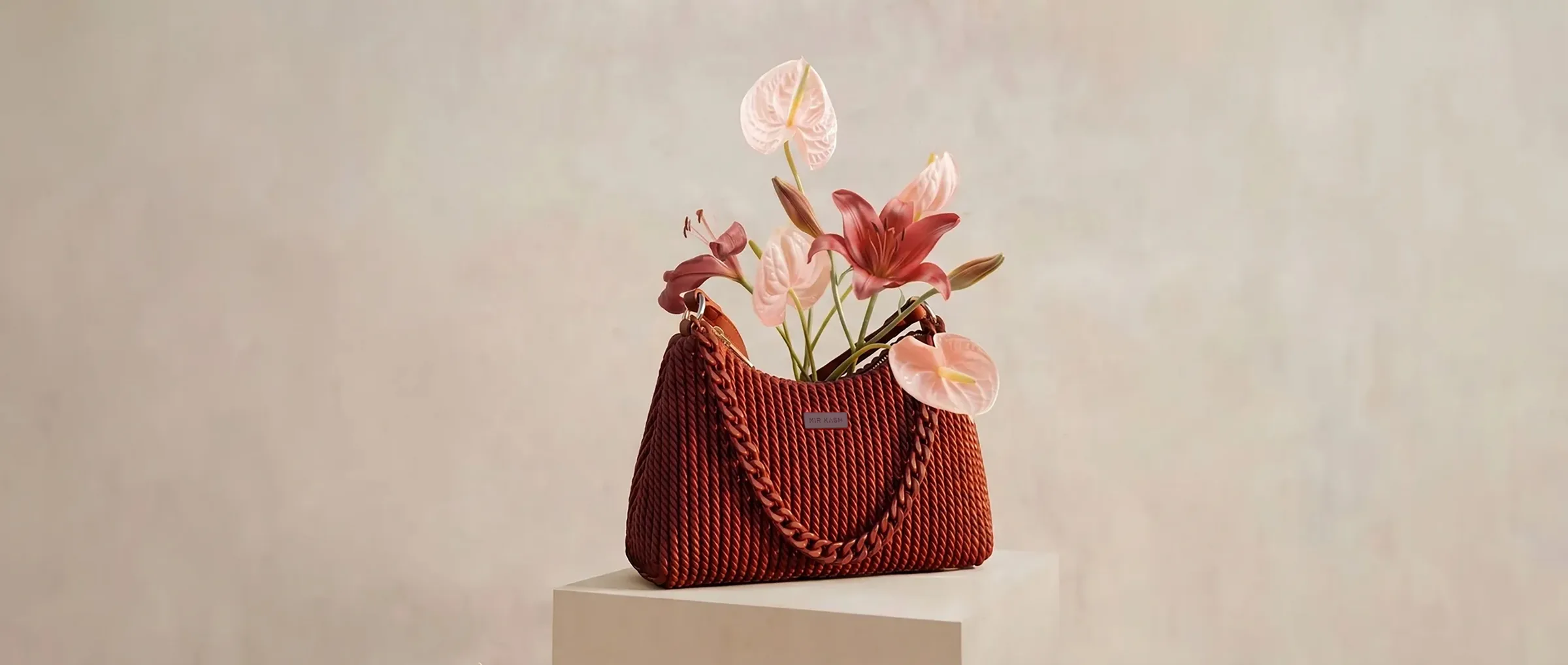 A Mir Kash vegan handbag styled with flowers